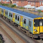 Picture of 507001 in Merseyrail 'good communications' livery at Ainsdale Station