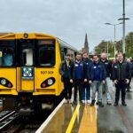 Photo of Class 507 Preservation Society Committee with 507001