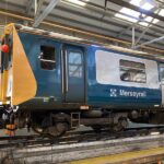 Side-on view of 507001 in Birkenhead north in early 2025