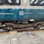 View of 507001 bogie with shoegear refitted, some tools still visible on the ground nearby