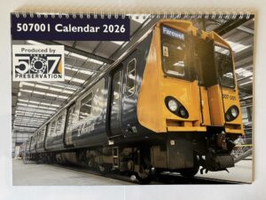 Front cover of 507001 calendar showing 001 in the shed at Derby.